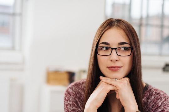 Thoughtful businesswoman wearing glasses