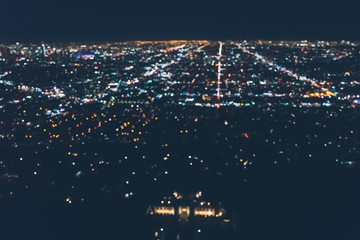 Aerial view of the sprawling Los Angeles cityscape from behind Griffith Park