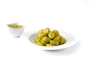 Gnocchi with pesto sauce in plate isolated on white background

