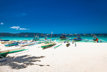 Boat at famous White Beach on Boracay Island, Philippines