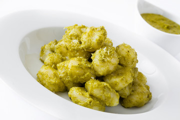 Gnocchi with pesto sauce in plate isolated on white background

