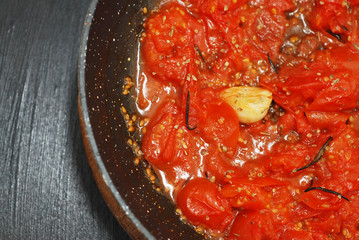 Close Up Vegan Tomatoe Italian Sauce in Black Pan for Pasta.