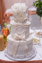 A traditional and decorative wedding cake at wedding reception.