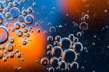 Oil drops on water surface abstract background