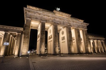 Germany, Berlin: Detail of illuminated  Brandenburg Gate (Brandenburger Tor) at night in the middle...