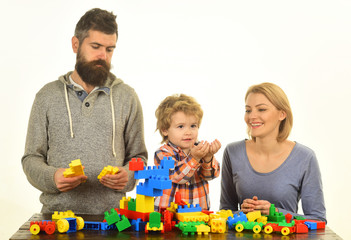 Kindergarten and family concept. Man with beard, woman and boy