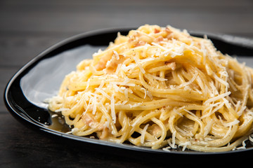 Spaghetti carbonara with egg and pancetta