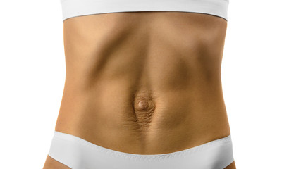Diastasis recti. Woman's abdomen divergence of the muscles of the abdomen after pregnancy and...