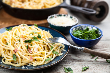 Spaghetti carbonara with egg and pancetta