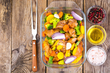 Frozen vegetables and chicken fillet for baking