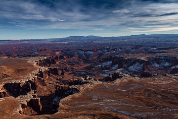 Magnificent Panoramic view of Canyonlands National Park in the winter with snow and cloudscape in Moab Utah USA.