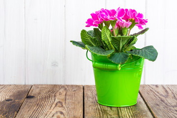 Rustic wooden table with bouquet of flowers as a mock-up or postcard