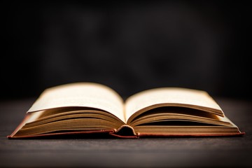 Open book on dark background