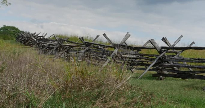 Civil War Time Split Rail Fence with Grass Field Slow Pan Wide, 4K