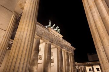 Germany, Berlin, Pariser Platz: Detail of illuminated Brandenburg Gate (Brandenburger Tor) at night in the middle of the German capital. The monument was built by king Frederick William II.