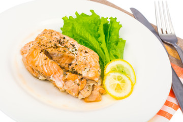 Dietary and healthy diet. Salmon steamed, lemon, green salad