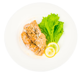 Dietary and healthy diet. Salmon steamed, lemon, green salad