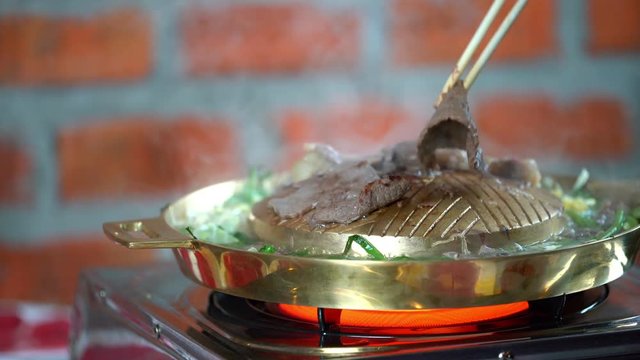 Korean BBQ Pork on brass pan 