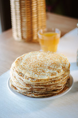 Pile of russian pancakes over the plate at restaurant