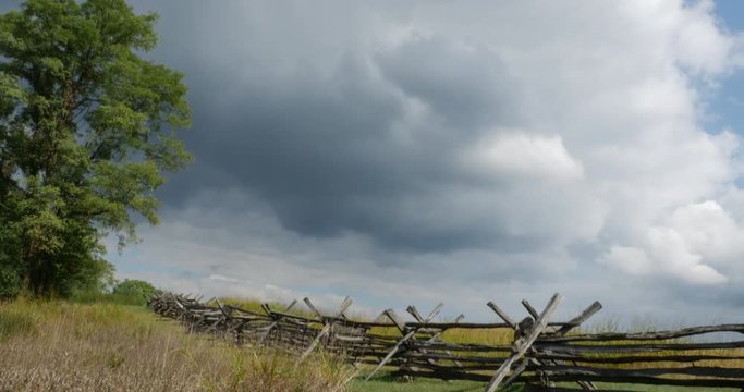 Civil War Time Split Rail Fence with Grass Field Slow Tilt Wide, 4K
