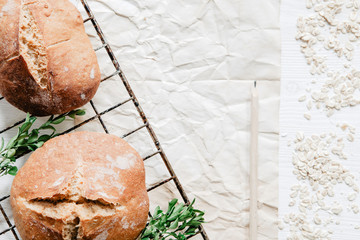 Freshly Baked Easter Bread on cooling rack with paper, pencil and boxwood