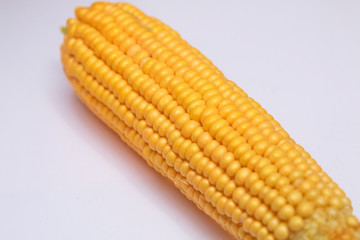 Corn on a white background, isolated . Sweet corn is delicious and ready to eat. Vegetables are beneficial to the body, have vitamins and delicious taste. on white background