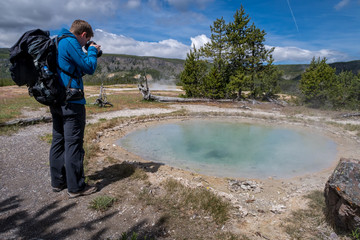 Obraz premium Man photographing Gem Pool