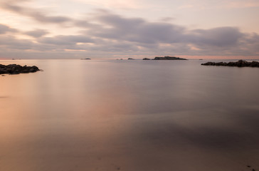 Fototapeta na wymiar A violet sunrise on the beach of Ses figueretes, Ibiza