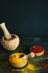 colorful spice turmeric pepper and olive wood