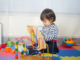 baby girl play toy at home