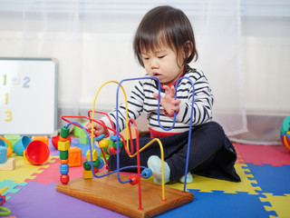 baby girl play toy at home