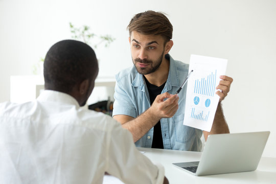 Financial advisor holding statistics showing rising charts graphs convincing african businessman to make business deal, manager consulting black client about loan, insurance, new project investment