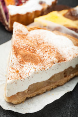 Cheese or sour cream pie with apples, close-up.