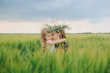 daughter gives mother wreath flowers hugs nature