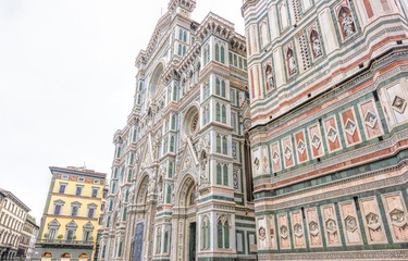 Obraz premium Daylight cloudy day view from bottom to ornamented facade of Cathedral Saint Mary