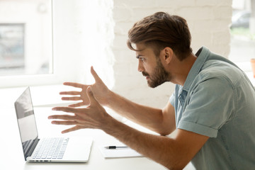 Furious man angry about bad news online or pc software failure, mad helpless office worker having...