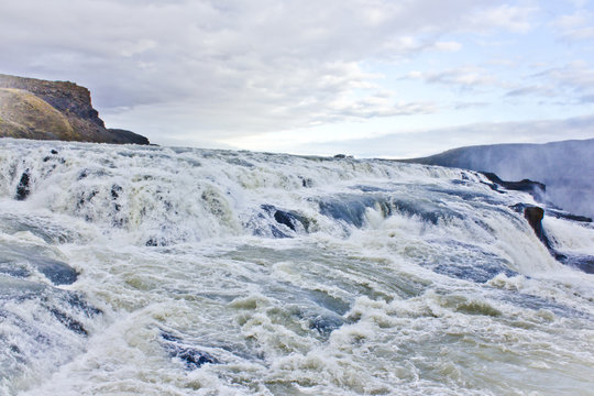 Closeup of the Rushing Waters Falling Down the Rocks of Gullfoss Waterfall in Iceland
