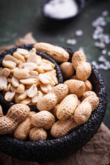 Raw peeled peanuts on bowl