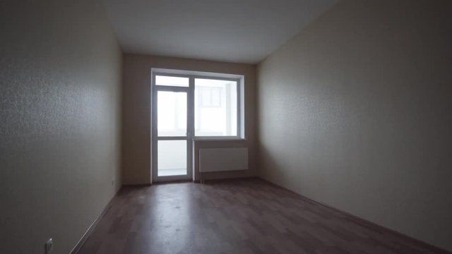 Empty bright living room without furniture. Clip. Interior empty light room without furniture in a new building renovation or under construction