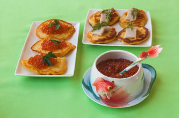 Red caviar and thick potato pancakes at Shrovetide (mass produced products)