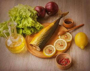 Mackerel smoked  and  vegetables on a cutting board