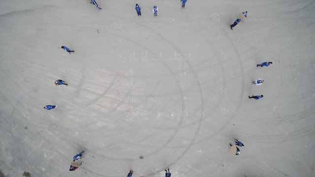 Top view on people doing a flash mob. Clip. A group of people making a figure out of their bodies. the Concept of society