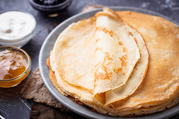Pancakes crepes with different jam and cream - obrazy, fototapety, plakaty