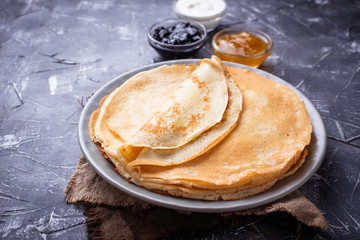 Pancakes crepes with different jam and cream