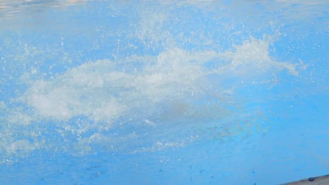 Teenage guy jump in swimming pool