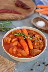 Spicy turkey goulash with mushrooms and carrots in tomato sauce.