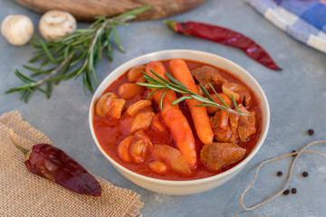 Spicy turkey goulash with mushrooms and carrots in tomato sauce.
