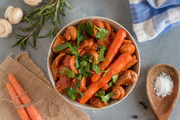 Spicy turkey goulash with mushrooms and carrots in tomato sauce.