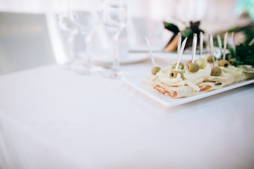 Catering service. Restaurant table with food and flower decoration. 