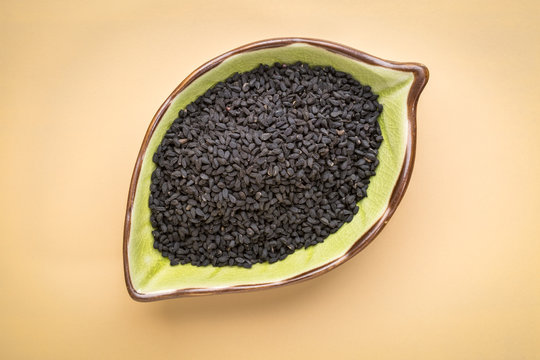 black cumin seeds in a leaf bowl